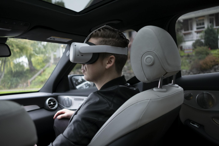 A man wearing VR goggles inside a luxury car, enjoying a virtual reality experience.